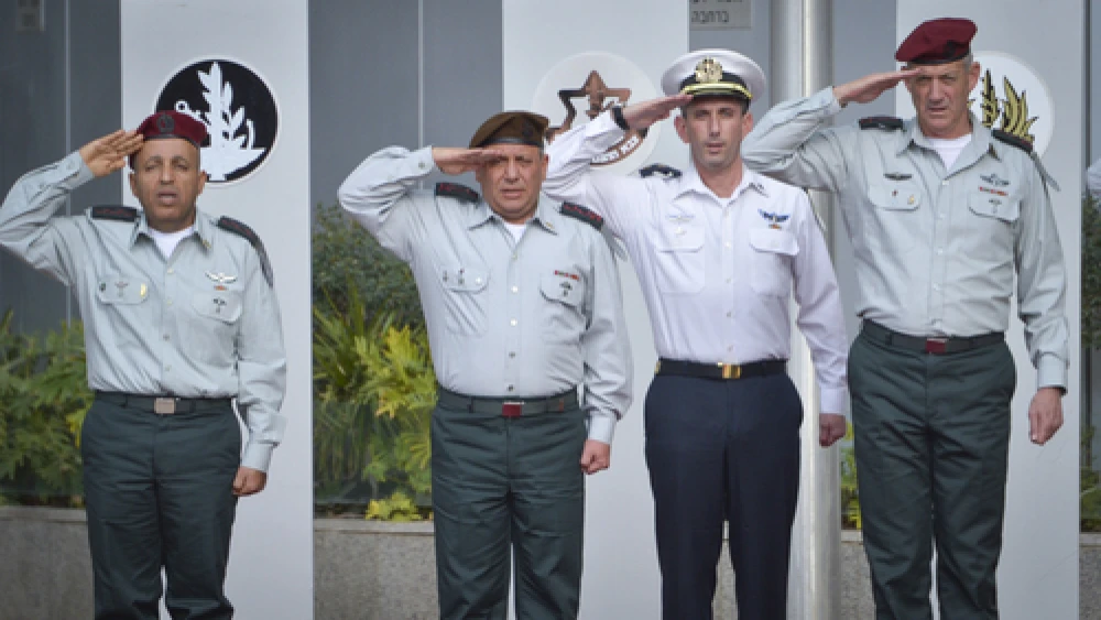 At the pictured ceremony in Tel Aviv on Monday, Gadi Eizenkot (second from left) succeeded Benny Gantz (far right) as chief of staff of the Israel Defense Forces. Photo by Flash90.