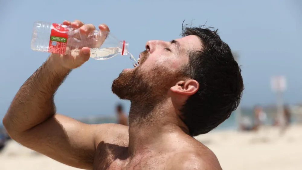 An Israeli at a Tel Aviv beach on July 4, 2024. Photo by Gideon Markowicz/TPS.