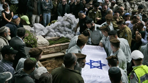 IDF soldiers carry the flag-draped coffin of their comrade, Maj. Eliraz Peretz, during his funeral at the Mount Herzl military cemetery in Jerusalem March 28, 2010. Photo by Abir Sultan/Flash 90.