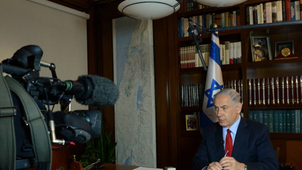 Click photo to download. Caption: Israeli Prime Minister Benjamin Netanyahu gives a television interview from his office in Jerusalem on March 5, 2015. Credit: Haim Zach/GPO.