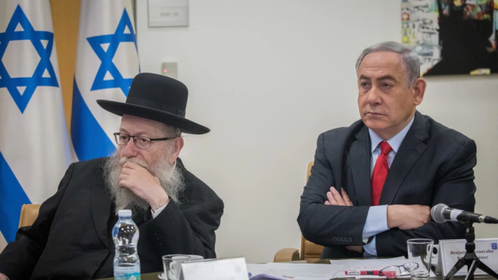 Israeli Prime Minister Benjamin Netanyahu and Health Minister Yaakov Litzman hold a video conference at the Foreign Ministry in Jerusalem with European leaders to discuss government responses to the coronavirus pandemic, March 9, 2020. Photo by Yonatan Sindel/Flash90.