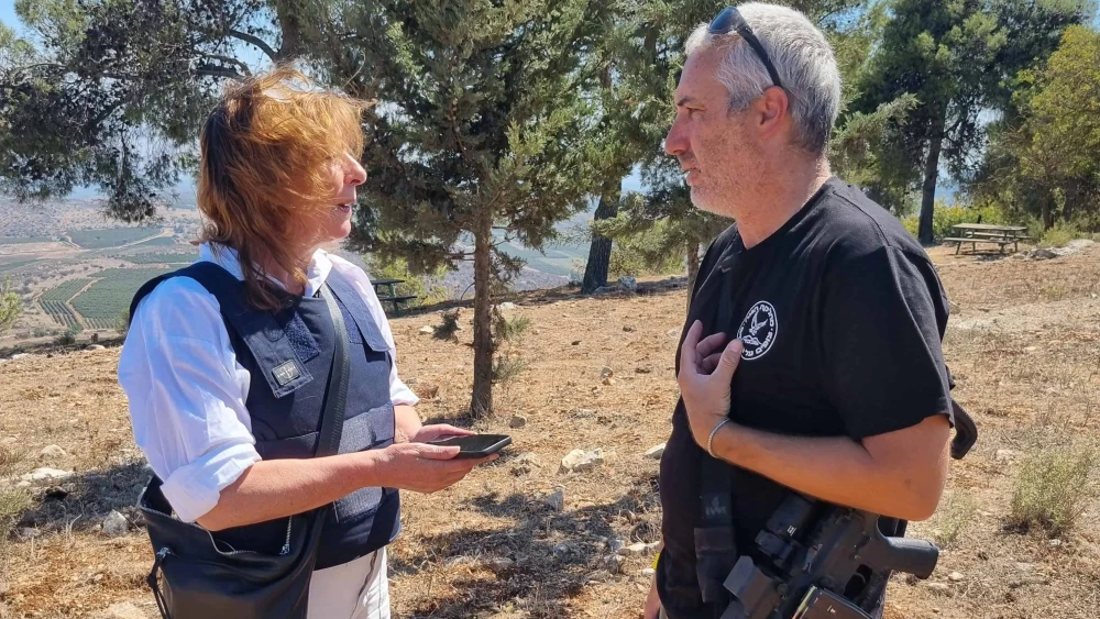 Esther Voet interviews a member of the defense team of kibbutz Malkya near Israel's border with Lebanon on Sept. 26, 2024. Photo by Bart Schut.