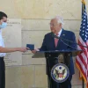U.S. Ambassador to Israel David Friedman hands the first U.S. passport with “Israel” listed to Jerusalem-born American citizen Menachem Zivotofsky at the U.S. embassy in Jerusalem on Oct. 30, 2020. Source: David M. Friedman/Twitter.