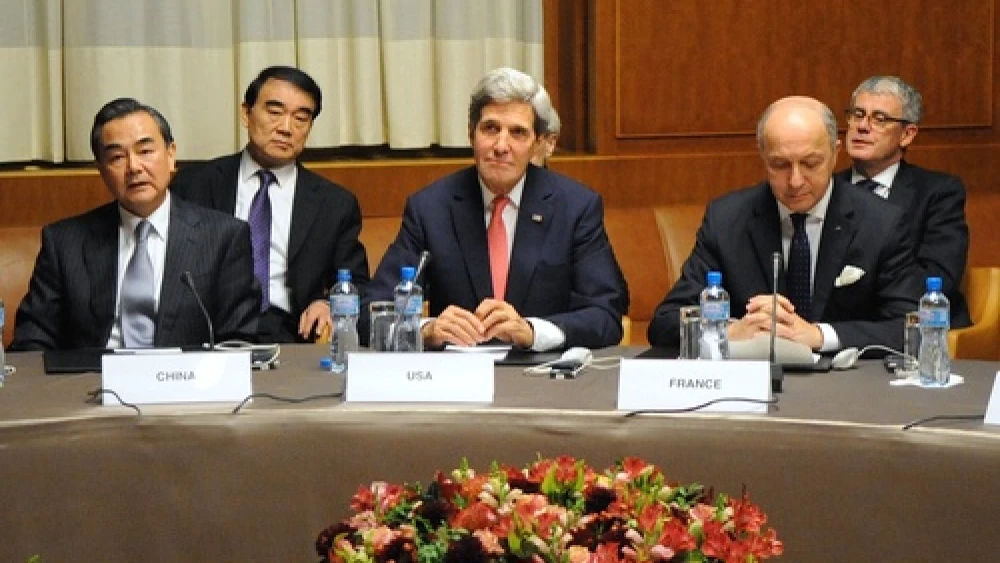 U.S. Secretary of State John Kerry (center), Chinese Foreign Minister Wang Yi and French Foreign Minister Laurent Fabius at U.N. headquarters after the P5+1 nations reached an interim nuclear deal with Iran in Geneva, Switzerland, on Nov. 24, 2013. Credit: U.S. State Department.