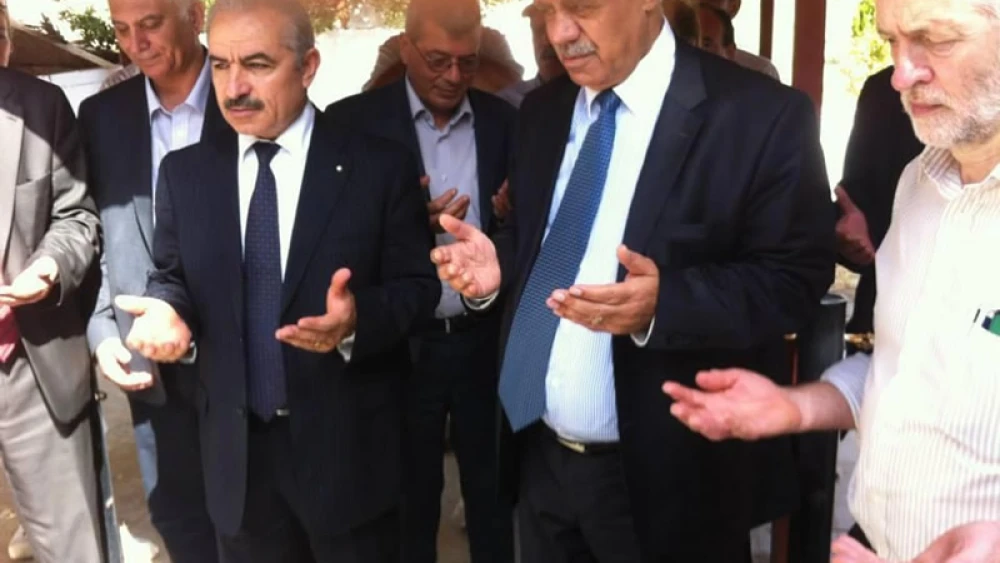 British Labour Party leader Jeremy Corbyn (right) before the grave of Atef Bseiso, the mastermind behind the massacre of 11 Israeli athletes at the 1972 Summer Olympics in Munich, as published in the British press.