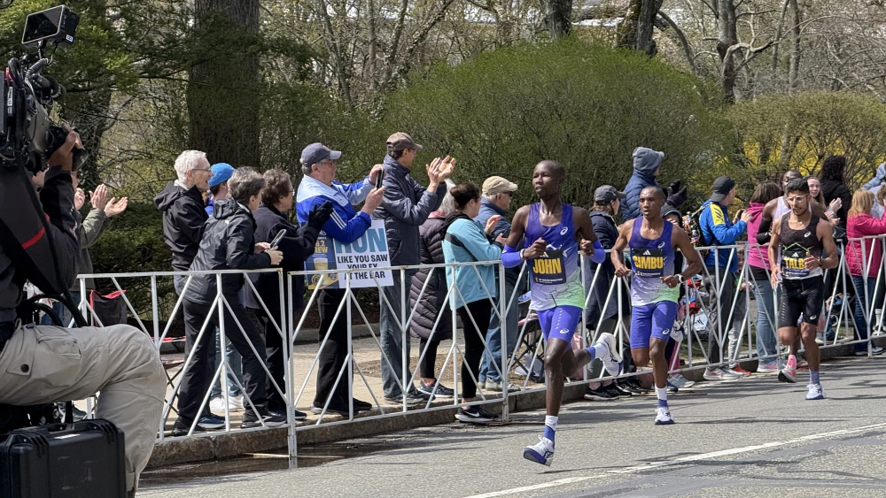 John Korir, Alphonce Felix Simbu and Zouhair Talbi lead the men in the 2026 Boston Marathon, near Walnut Street in Newton, just past Mile 19. Korir won, Simbu finished second. Talbi, fifth, was the fastest American. 20 April 2026. Credit: Arnold Reinhold via Wikimedia Commons.
