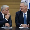 Then-Blue and White Party leaders Yair Lapid (left) and Benny Gantz attend a faction meeting at the opening of the 22nd Knesset in Jerusalem, Oct. 3, 2019. Photo by Hadas Parush/Flash90.