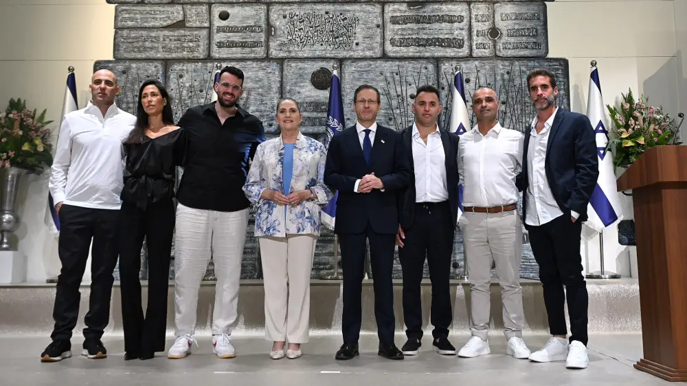 The six recipients of Israel’s Presidential Award for Civilian Heroism with President Isaac Herzog and his wife, Michal, at the President’s Residence in Jerusalem, Oct. 8, 2026. Photo by Haim Zach/GPO.