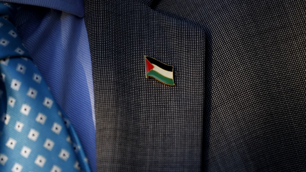 A demonstrator wears a Palestinian flag on his lapel during a protest against U.S. President Donald Trump's recognition of Jerusalem as the capital of Israel, in front of the U.S. embassy in Santiago, Dec. 11, 2017. Photo credit: Pablo Vera/AFP via Getty Images.