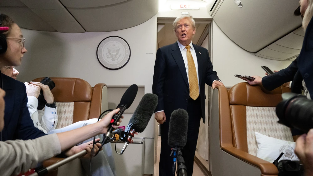 U.S. President Donald Trump speaks with the media aboard Air Force One shortly after departure from Royal Air Force Mildenhall in the United Kingdom, July 8, 2026. Photo by Saul Loeb/AFP via Getty Images.