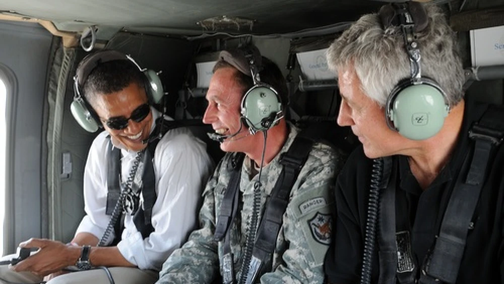 Click photo to download. Caption: In July 2008, U.S. Army Gen. David H. Petraeus (center), then commander of Multi-National Force-Iraq, gives an aerial tour of Baghdad to then Senators Barack Obama (far left) and Chuck Hagel (far right). Credit: U.S. Air Force/Staff Sgt. Lorie Jewell.