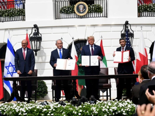 Israeli Prime Minister Benjamin Netanyahu, U.S. President Donald Trump, UAE Foreign Minister Abdullah bin Zayed Al Nahyan and Bahraini Foreign Minister Abdullatif bin Rashid Al Zayani hold up the Abraham Accords, during the signing ceremony at the White House, Sept. 15, 2020. Photo by Avi Ohayon/GPO.