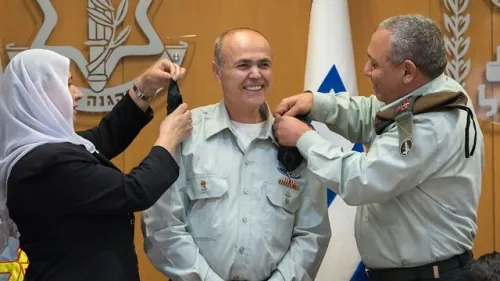 Kamil Abu Rokon receives the rank of major general from IDF Chief of Staff Gadi Eizenkot, right, and Abu Rokon's wife in a ceremony at IDF headquarters in Tel Aviv on March 29, 2018. Credit: IDF Spokesperson's office.