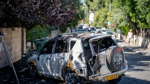 View of a car burned after a garbage bin was set on fire by protesters demanding the release of the hostages in Gaza, near the Prime Minister’s residence in Jerusalem, Sept. 3, 2025. Photo by Chaim Goldberg/Flash90.