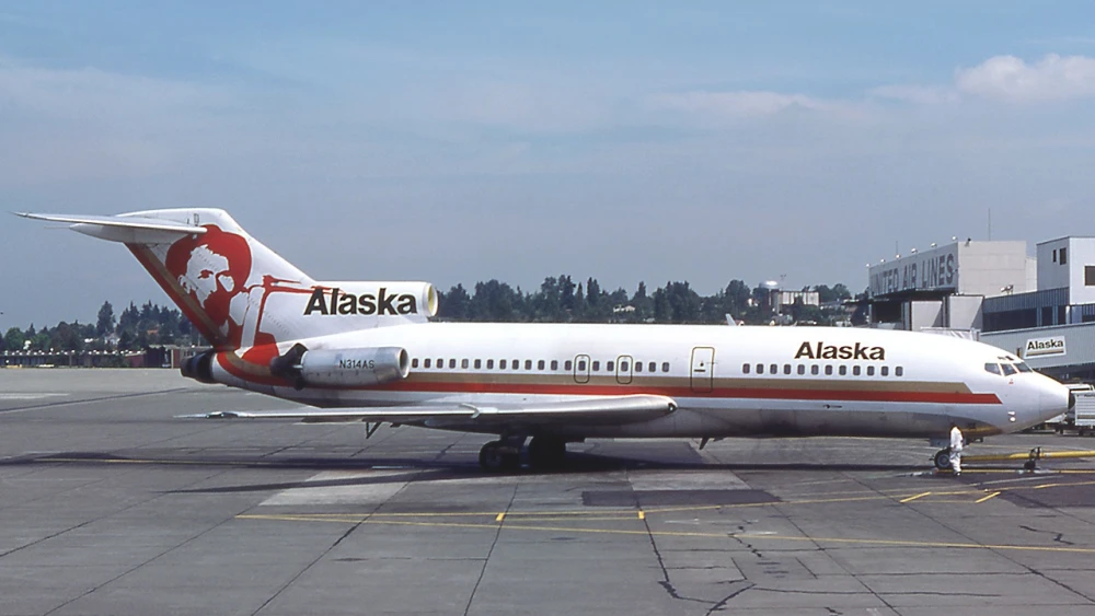 An Alaska Airlines Boeing 727-100 at Seattle–Tacoma International Airport in the mid 70s livery, Aug. 11, 1976. Photo by Michel Gilliand via Wikimedia Commons.