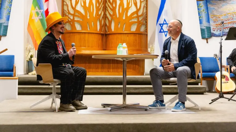 Boy George on stage at Temple Sholom with Rabbi Dan Moskovitz. Vancouver, British Columbia. Sept. 9, 2026. Credit: Rhonda Dent Photography.