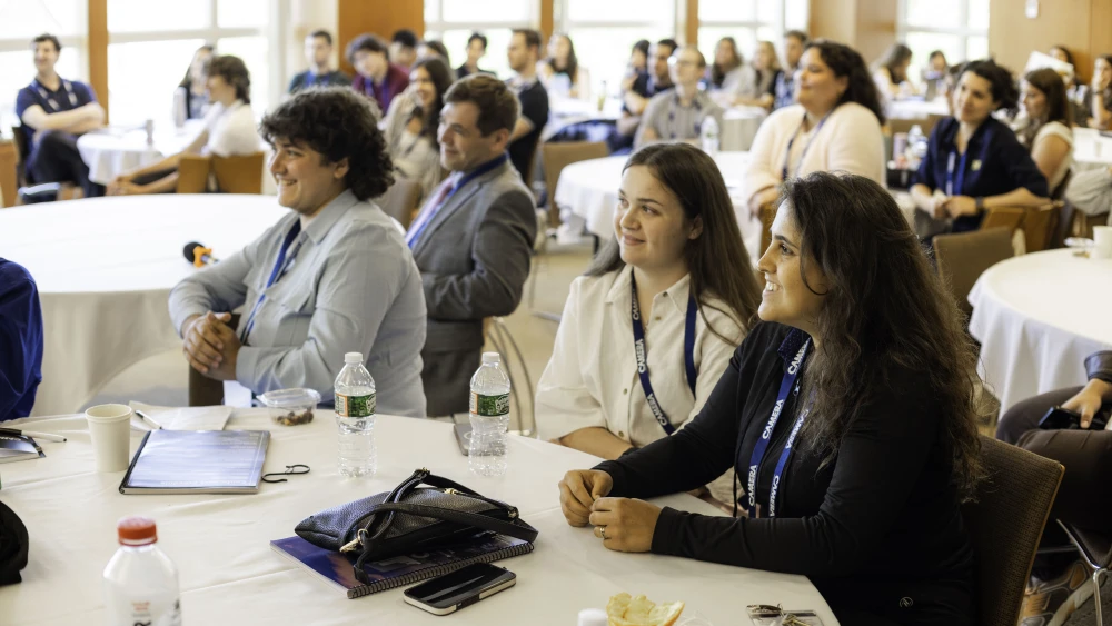 Students and staff engage with speakers during one of the main sessions