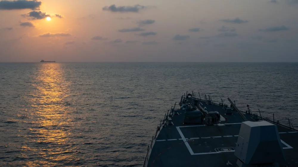 Guided-missile destroyer USS Pinckney (DDG 91) observes a merchant vessel while on patrol enforcing the U.S. blockade against Iran, May 4, 2026. Credit: U.S. Central Command.