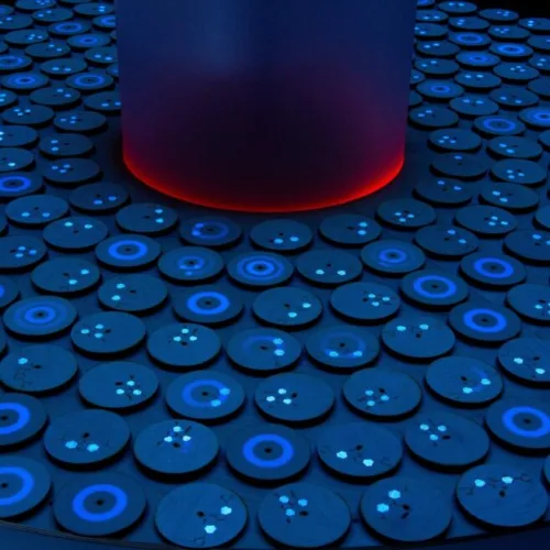 Ela Goldman’s spinning and resting tops carry fluorescent molecules to illustrate professor Dror Fixler's experiments using gold nanoparticles to detect disease. Photo by Michael Amar.