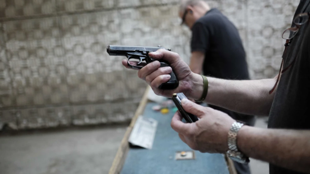 Israelis practice shooting handguns at the Olympic Shooting Range in Herzliya, following a wave of terror attacks in Jerusalem and Israel. Oct. 18, 2015. Photo by Tomer Neuberg/Flash90.
