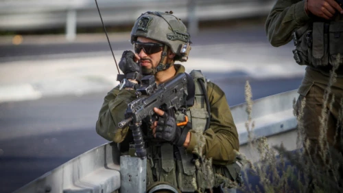 An Israeli soldier near the scene of a suspected vehicular assault near Yitzhar, Sept. 24, 2022. Photo by Nasser Ishtayeh/Flash90.