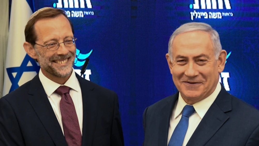 Israeli Prime Minister Benjamin Netayahu and Zehut Party leader Moshe Feiglin hold a joint press conference at Kfar Hamacabiah in Ramat Gan on Aug. 29, 2019. Photo by Flash90.