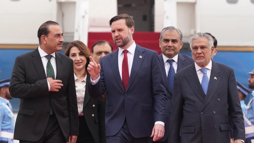 U.S. Vice President JD Vance (center) walks with Pakistan's Chief of Defence Forces and Chief of Army Staff Field Marshall Asim Munir (left), and Pakistani Deputy Prime Minister and Foreign Minister Mohammad Ishaq Dar after arriving for talks with Iranian officials in Islamabad, on April 11, 2026. Photo by Jacquelyn Martin/Pool/Getty Images.