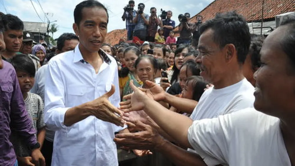 Indonesian President Joko Widodo (left) visits the country's capital of Jakarta. Credit: Jokowi Blusukan via Wikimedia Commons.