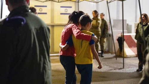 Freed Israeli hostage Eitan Yahalomi, 12, meets his mother upon his return to Israel at the Kerem Shalom Crossing on Nov. 27, 2023. Credit: IDF Spokesperson.