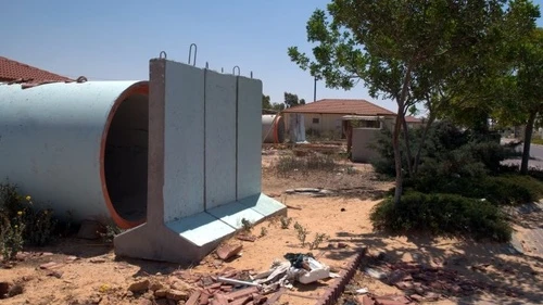 Click photo to download. Caption: A sewer pipe bomb shelter in the farming village of Yevul, alongside the Gaza Strip. Credit: B. Davidson.