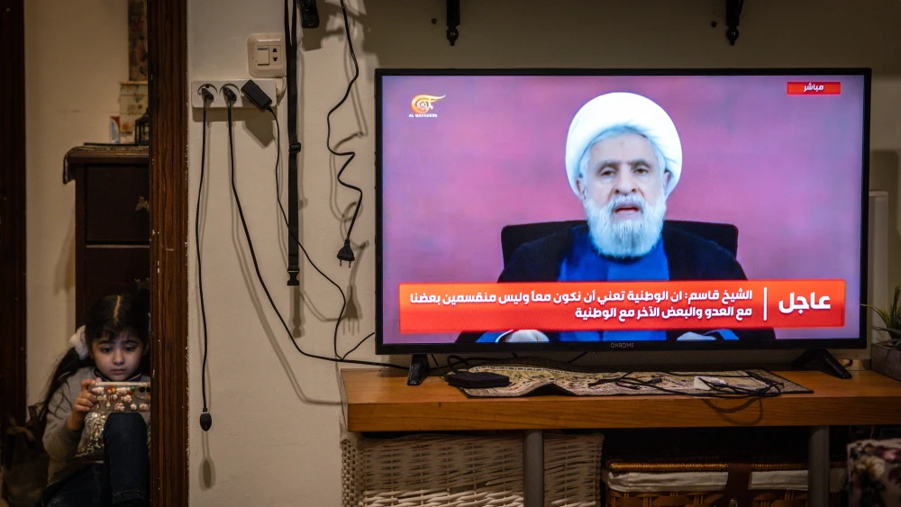 Hezbollah Secretary-General Naim Qassem appears on TV to address the Iranian-backed terror group's supporters, April 13, 2026. Photo by Chris McGrath/Getty Images.