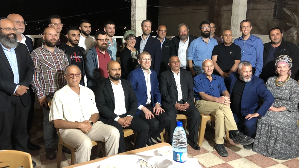 Guests at an Iftar gathering attended by Jews and Arabs, hosted by Palestinian businessman Ashraf Jabari in Hebron, April 2021. Photo by Josh Hasten.