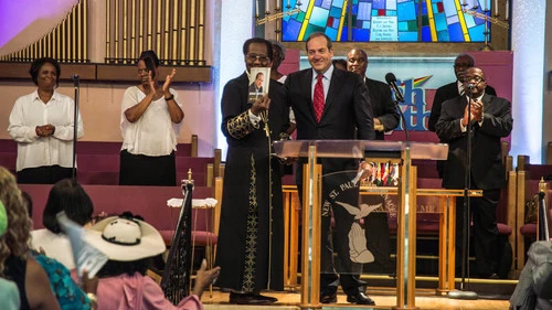In August 2015 in Detroit, Rabbi Yechiel Eckstein (center right, at podium), founder and president of the International Fellowship of Christians and Jews, visits the New St. Paul Tabernacle Church of God in Christ, which is part of the nation's largest black Pentecostal denomination. Credit: Justin McMahan.