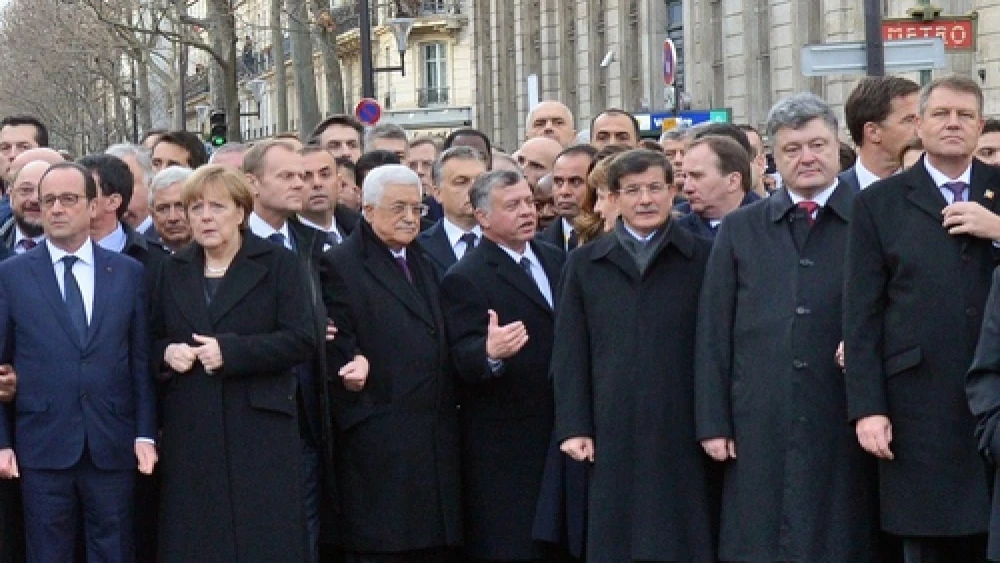 Palestinian Authority leader Mahmoud Abbas—third from left in the front row, between German Chancellor Angela Merkel and Jordan's King Abdullah at the Jan. 11 solidarity march against terrorism in Paris—condemned the attack on the French satirists at Charlie Hebdo, but recently jailed and tortured a Palestinian satirist. Credit: Haim Zach/GPO.