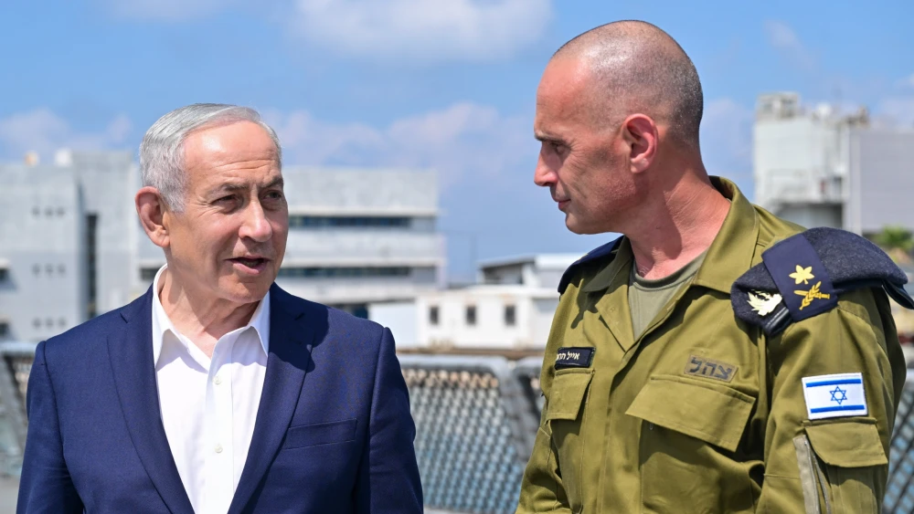 Israel’s Prime Minister Benjamin Netanyahu speaks with Israel Navy Commander Vice Adm. Eyal Harel during a visit to the Haifa Naval Base on July 7, 2026. Photo by Kobi Gideon/GPO.