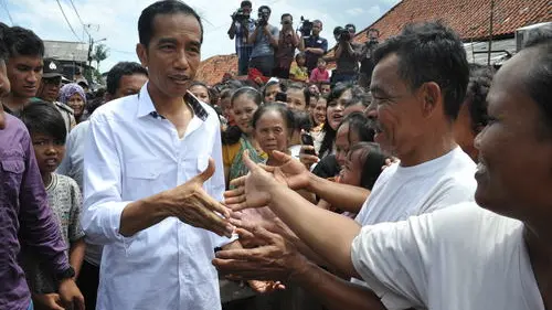 Indonesian President Joko Widodo (left) visits the country's capital of Jakarta. Credit: Jokowi Blusukan via Wikimedia Commons.