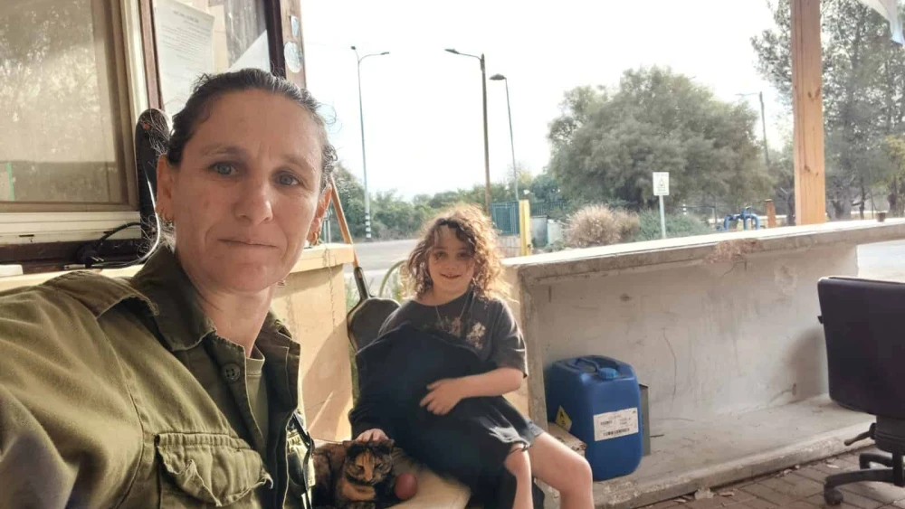 Annat Zisovich Charitt spends some time with her daughter as she guards their kibbutz, Yiftach, in 2024. Credit: Courtesy of Annat Zisovich Charitt.