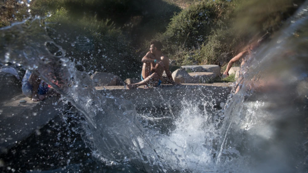 Young Israelis enjoy the cool waters of the Ein Aya spring in the Golan Heights on July 29, 2018. Photo by Hadas Parush/Flash90.