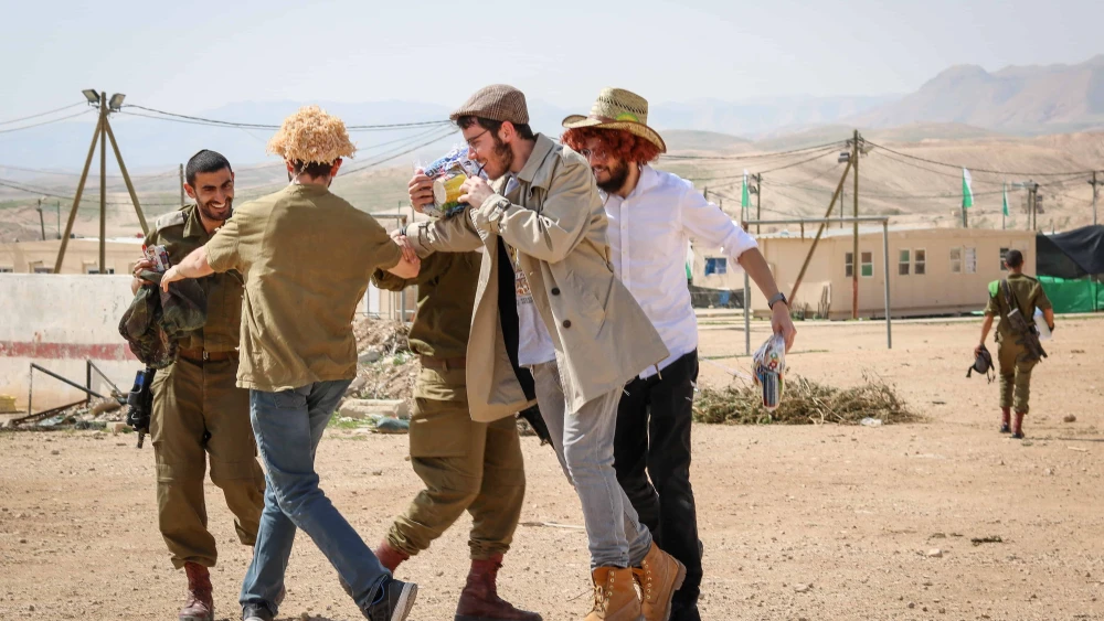 Israeli soldiers celebrate Purim at an army base in southern Israel, Feb. 28, 2018. Photo by Liba Farkash/Flash90.