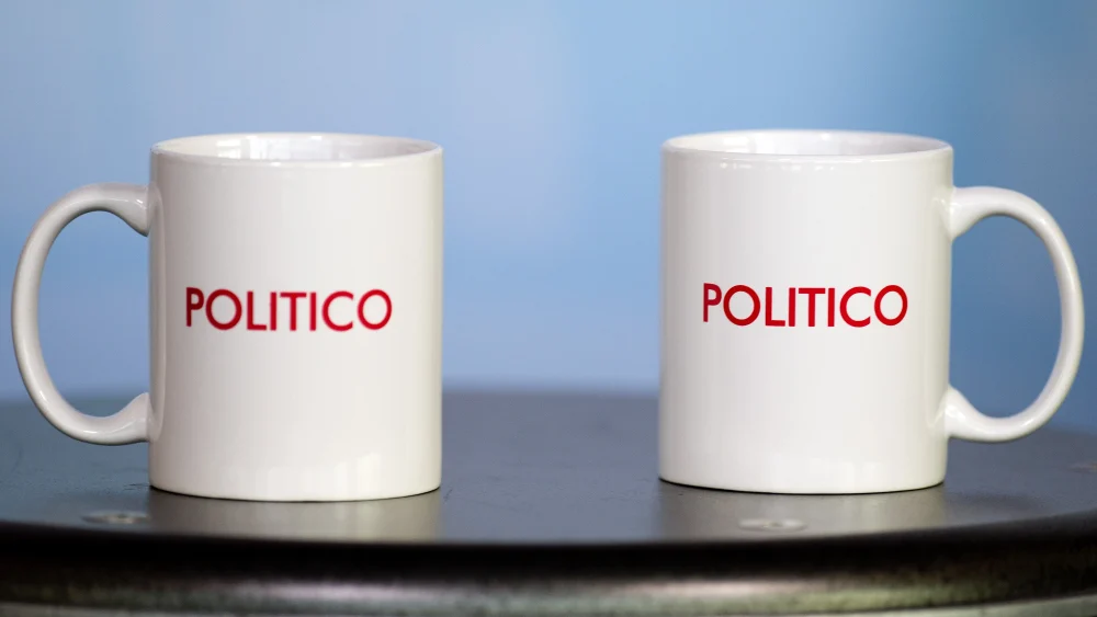 Politico coffee mugs on a table during the Politico Playbook Breakfast at the Newseum in Washington, DC, Nov. 28, 2012. Photo by Jim Watson/AFP via Getty Images.