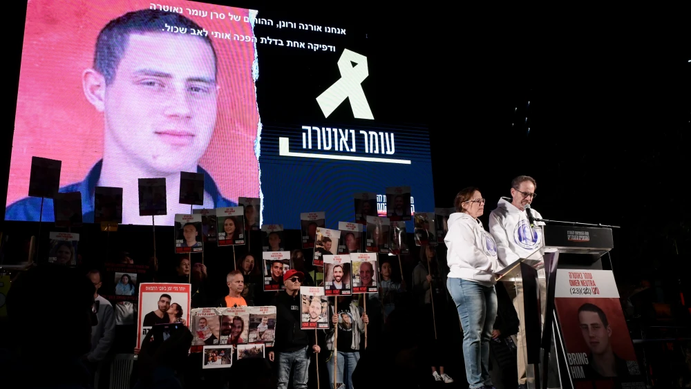 The parents of Omer Neutra, Ronen and Orna, at a rally calling for the release of the Israeli hostages held captive by Hamas in Gaza, marking 435 days since the start of the war between Israel and Hamas, at Hostage Square in Tel Aviv, Dec. 14, 2024. Credit: Avshalom Sassoni/Flash90.