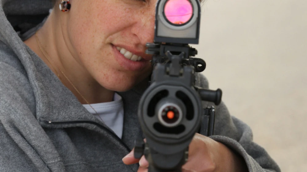 An Efrat resident learning how to use an automatic rifle at a firing range in Gush Etzion, April 29, 2010. Photo by Nati Shohat/Flash90.