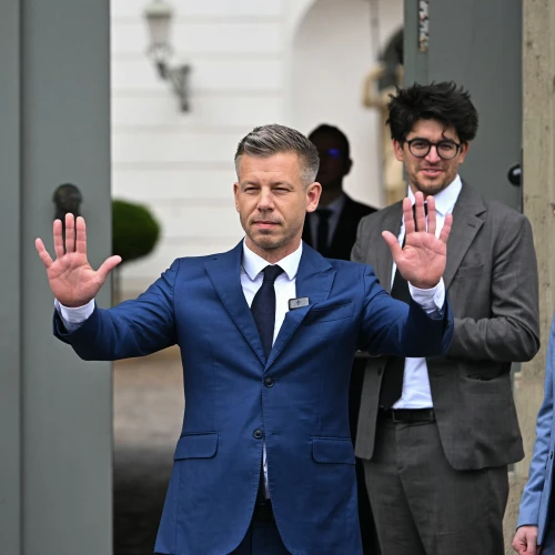 Prime Minister-elect Péter Magyar arrives at the entrance of the presidential Sándor Palace in Budapest before meeting with Hungary's president and other parliamentary parties, three days after general elections, on April 15, 2026. Photo by Attila Kisbenedek/AFP via Getty Images.