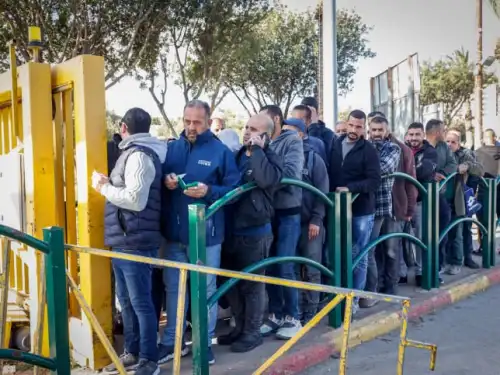Palestinian workers line up at the entrance to Ma'ale Adumim near Jerusalem, Feb. 23, 2023. Photo by Erik Marmor/Flash90.