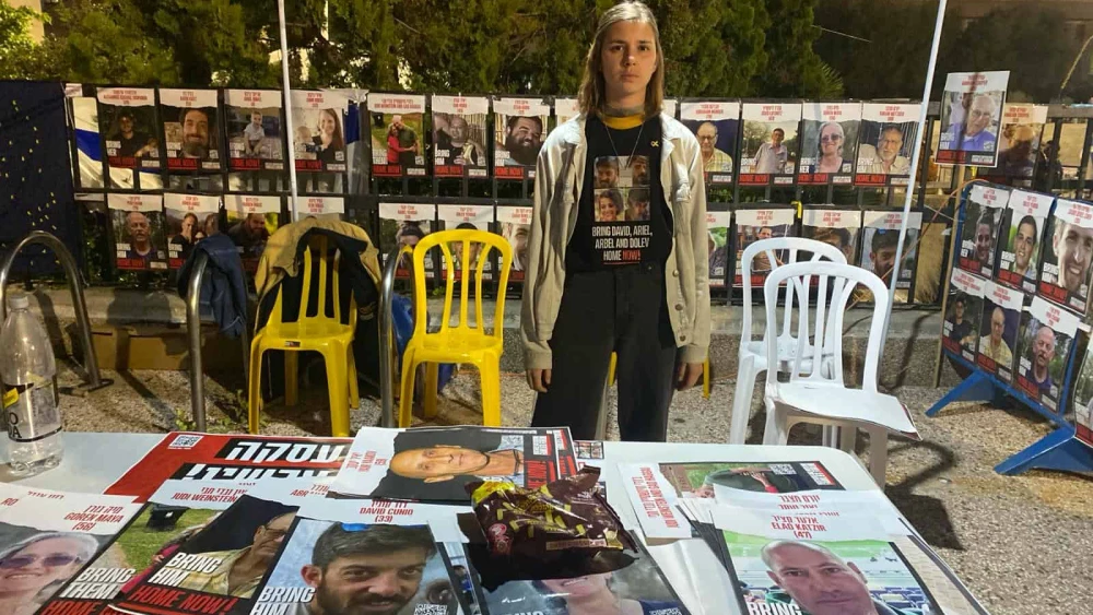 Illy Markovich, manager of Kedma's student hostel in Kiryat Gat, inside the Nir Oz tent she helped build at Tel Aviv's Hostage Square, Feb. 10, 2024. Photo by Amelie Botbol.