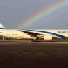 An El Al plane on the runway of Ben-Gurion International Airport with a rainbow in the background. Credit: Courtesy.
