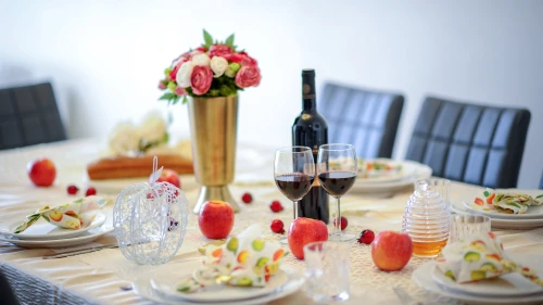 A dinner table set for the traditional Rosh Hashanah meal. Photo by Mendy Hachtman/Flash90.