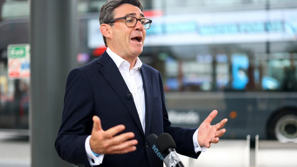Britain's Prime Minister, Andy Burnham, speaks to the media, as he visits Wolverhampton Bus Station in Wolverhampton, England on Aug. 18, 2026. Photo by Hannah McKay - WPA Pool/Getty Images.