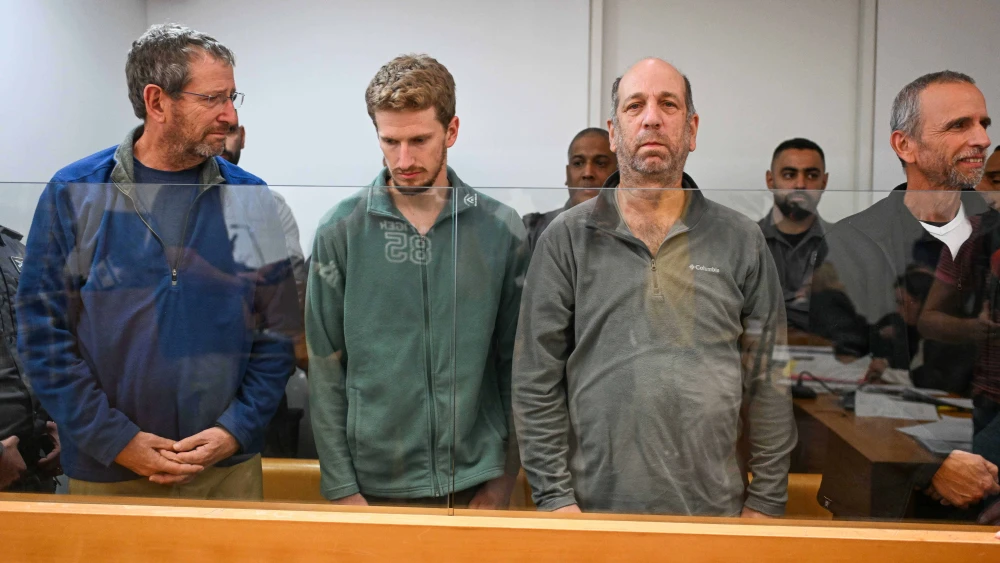 Four men, including Rear Adm. (res.) Ofer Doron (left), accused of firing flares at Prime Minister Benjamin Netanyahu's private residence in Caesarea, arrive for a hearing at the Haifa District Court on Dec. 2, 2024. Credit: Flash90.