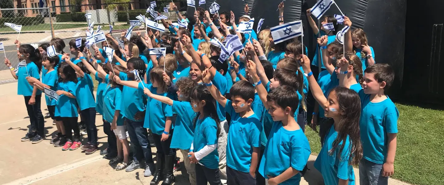 Children at the Kavod Charter School in San Diego. While math, reading and writing are taught in English, much of the rest of the school day—from morning meeting to art class to physical education and even recess are conducted in Hebrew. Source: Kavod Charter School via Twitter.